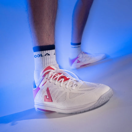 JOOLA SM4Sh Table Tennis Shoe in white and red, designed for training and competition, featuring lightweight and grip-enhanced sole.