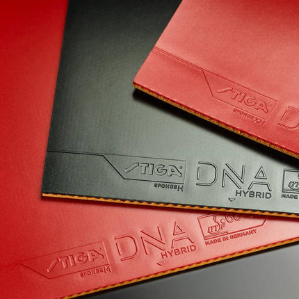 Stiga DNA Hybrid H inverted table tennis paddle with red and black rubber, designed for professional competitive play.